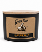 Gooey Duck Candle Co candle with a wooden lid on a white background