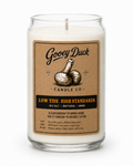 Gooey Duck candle with a label on a white background