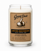 Gooey Duck candle with a label on a white background