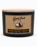 Gooey Duck Candle Co. candle with a label on a white background