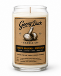 Gooey Duck Candle Co candle with label on a white background