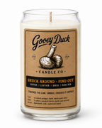 Gooey Duck Candle Co candle with label on a white background