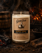 Gooey Duck candle with a label in front of a fireplace