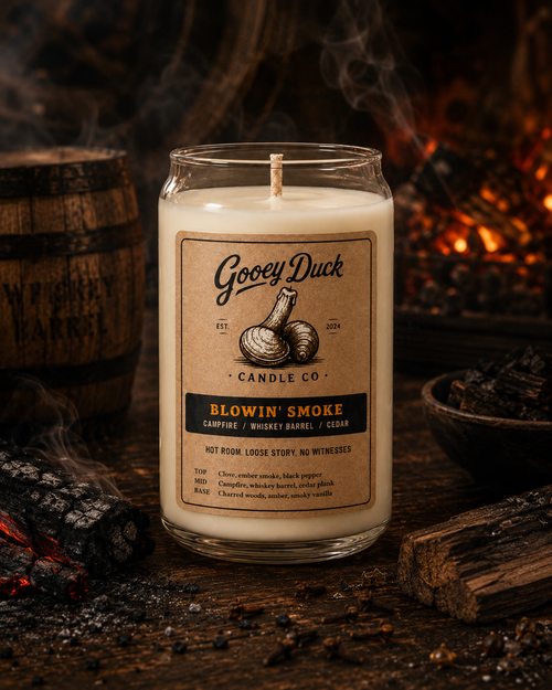 Gooey Duck candle with a label in front of a fireplace