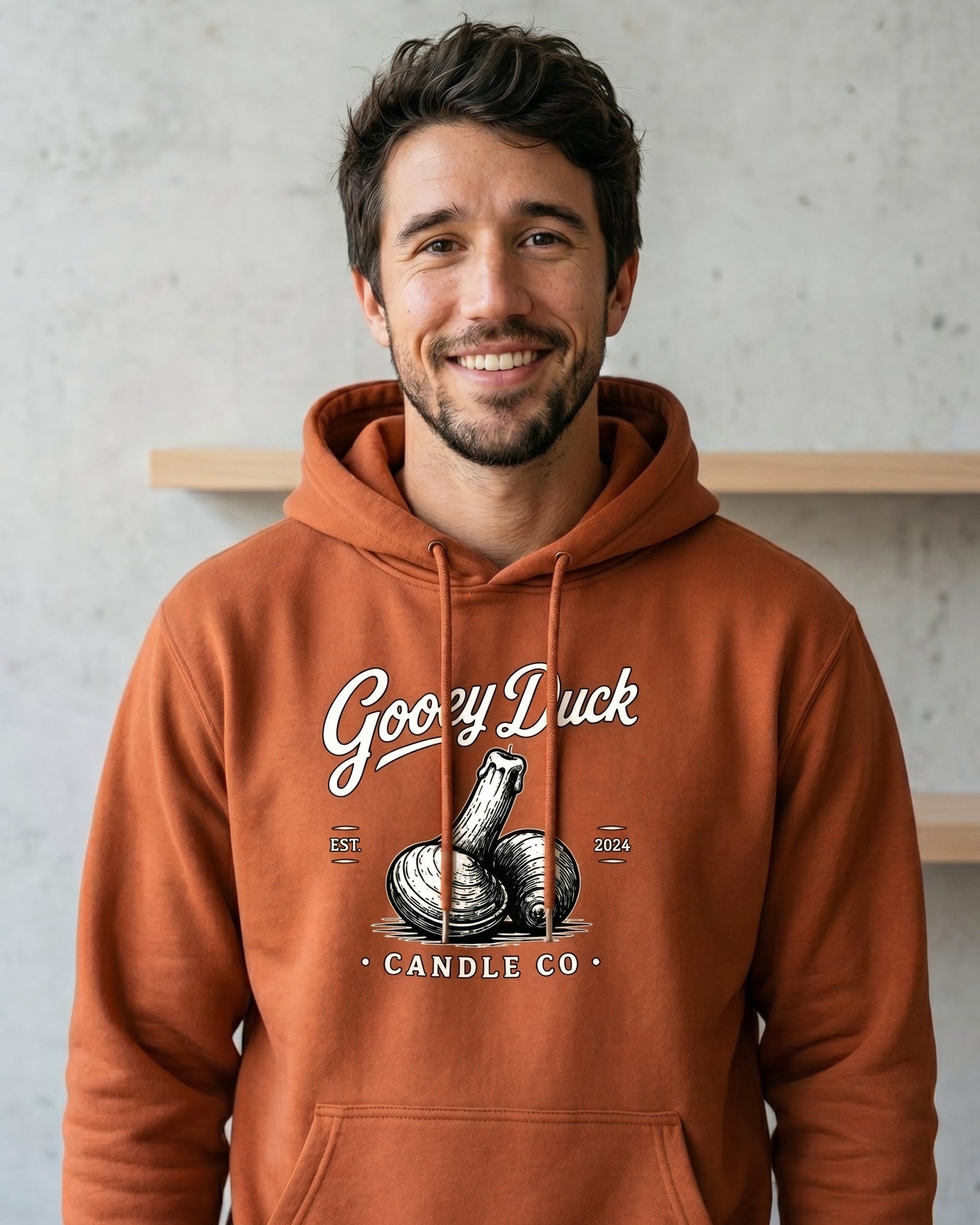 Model wearing orange Gooey Duck Clam Logo Hoodie