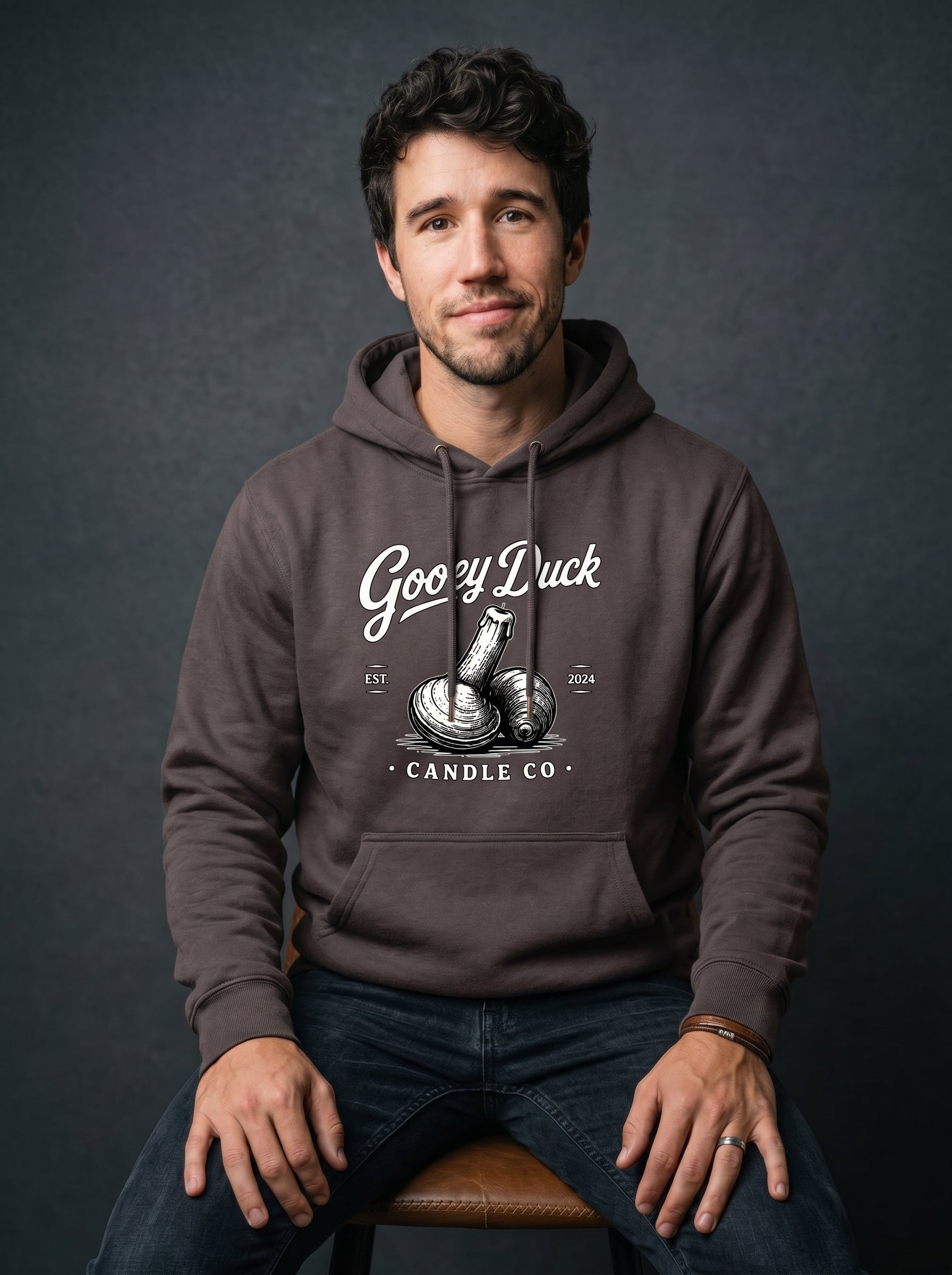 Model wearing dark chocolate brown Gooey Duck Clam Logo Hoodie