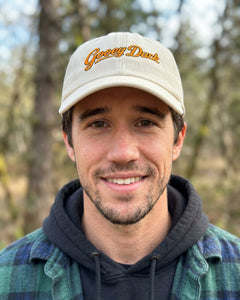 Model wearing Gooey Duck Logo Cap outdoors